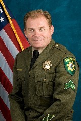 A man in a sheriff uniform